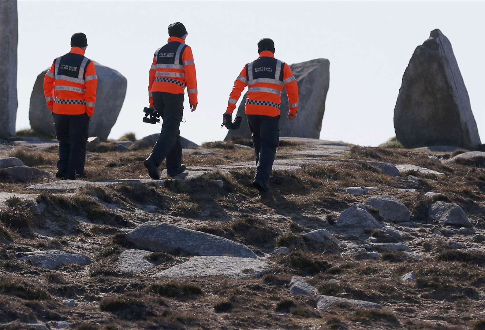 Members of the Irish Coast Guard search the coastline near Blacksod, Co Mayo, following the R116 crash (Chris Radburn/PA)