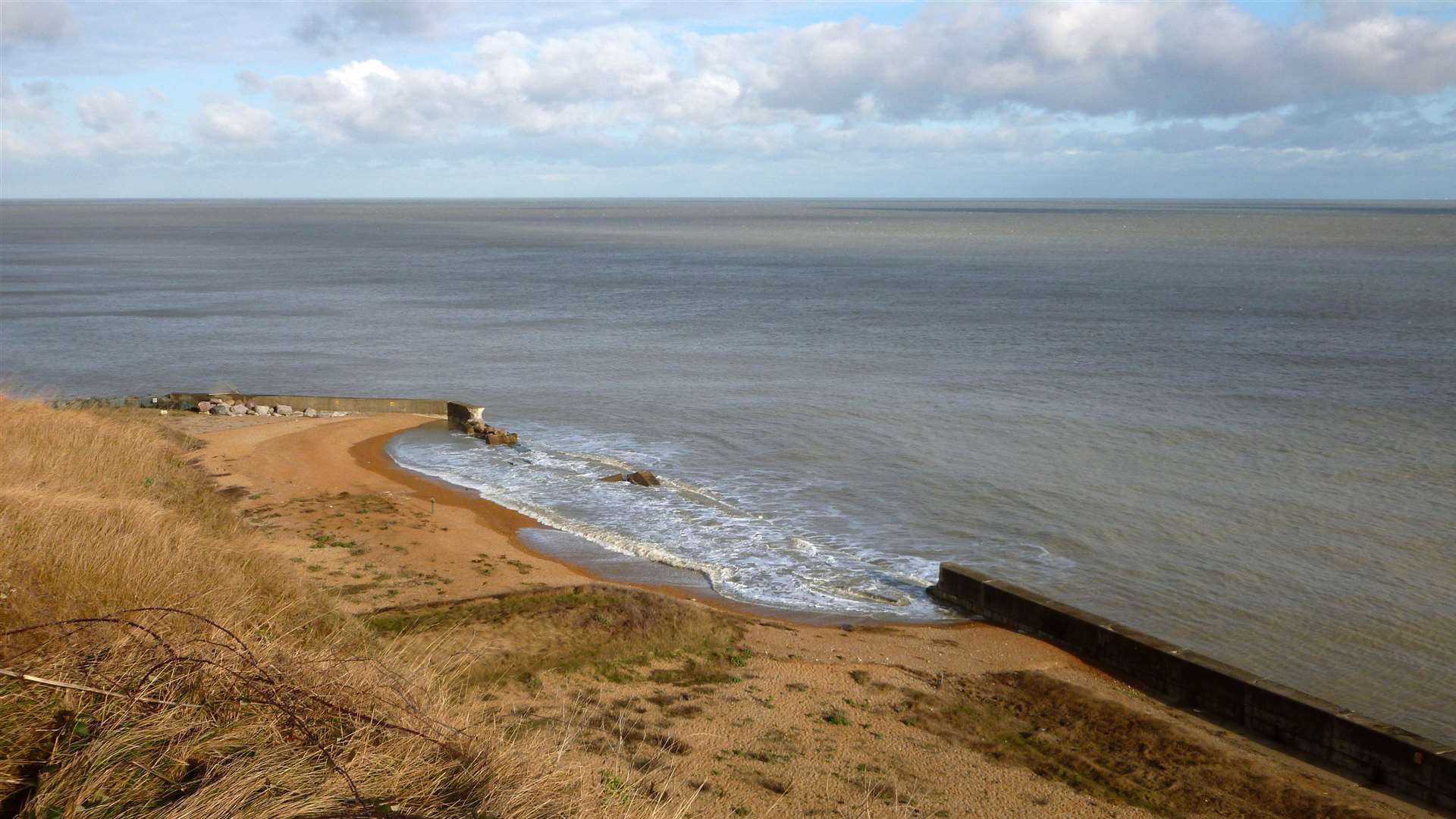 Broken-through sea defences at the Old Rifle Range, Kingsdown