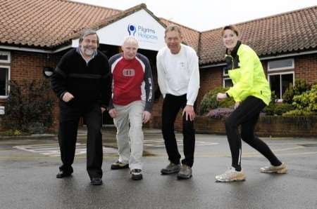 Pilgrims Hospices fund-raiser Susan Booth with Canterbury Half-Marathon organisers Mike Gratton, Neil Proctor and Martyn Rouse. Picture: Paul Amos