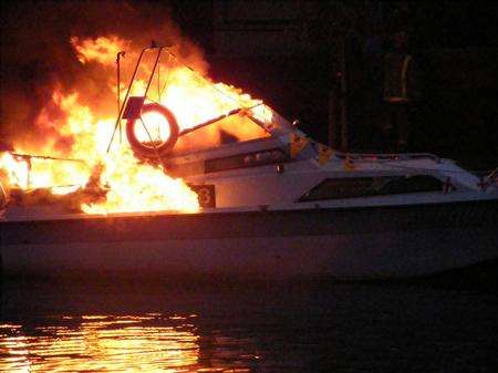 Boat on fire at the River Festival. Picture: Debbie Ball