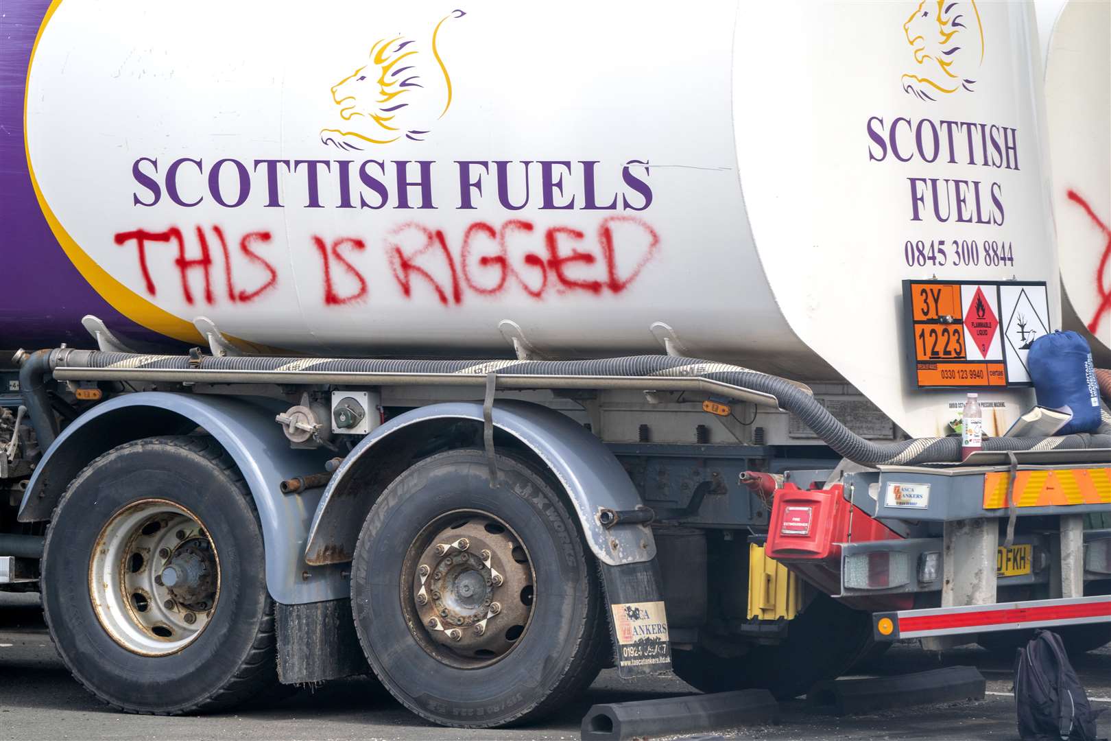 This Is Rigged was sprayed on an oil tanker at the Ineos refinery in Grangemouth (Jane Barlow/PA)