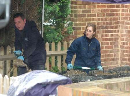 Scenes of crime officers at work digging up the garden at Irvine Drive, Margate