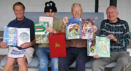 PROGRAMMED FOR SUCCESS: Faversham Town trustee Ken Hammond, second right, and committee men, from left, Bob Heward, Roger Bennett and Syd Medley with the box set of 18 programmes from the final season at Wembley Stadium. Picture: James Brown.