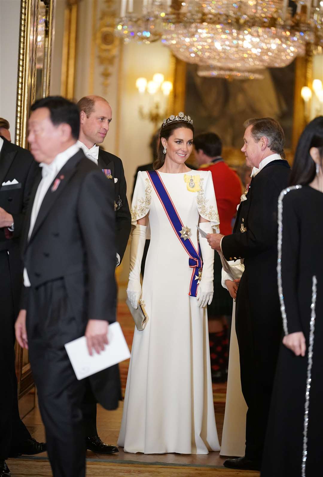 The Princess of Wales, in a Jenny Packham gown, teamed with white gloves, and the Prince of Wales ahead of the state banquet (Yui Mok/PA)