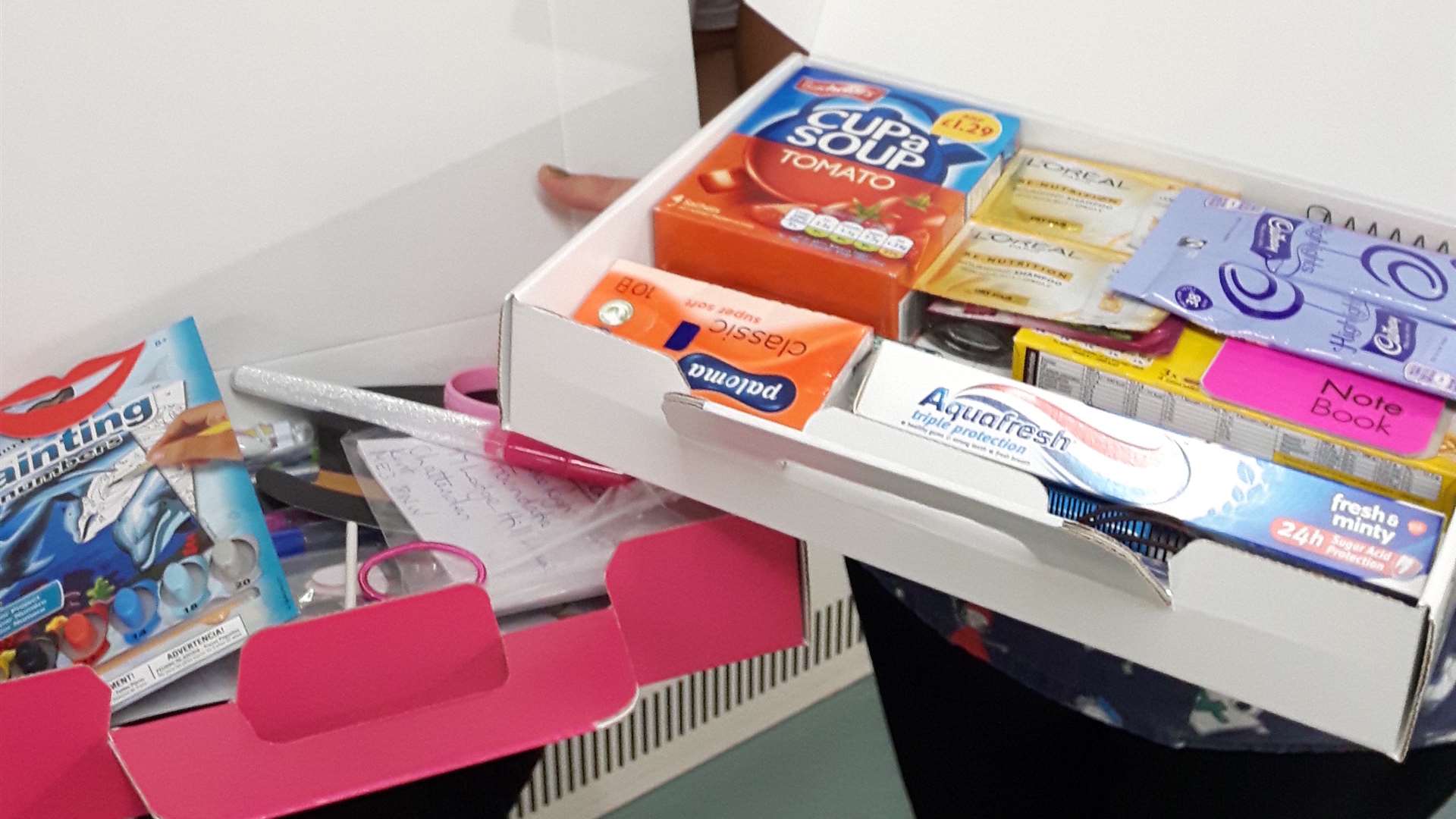 The boxes contain essentials such as a toothbrush, shampoo and packets of instant soup