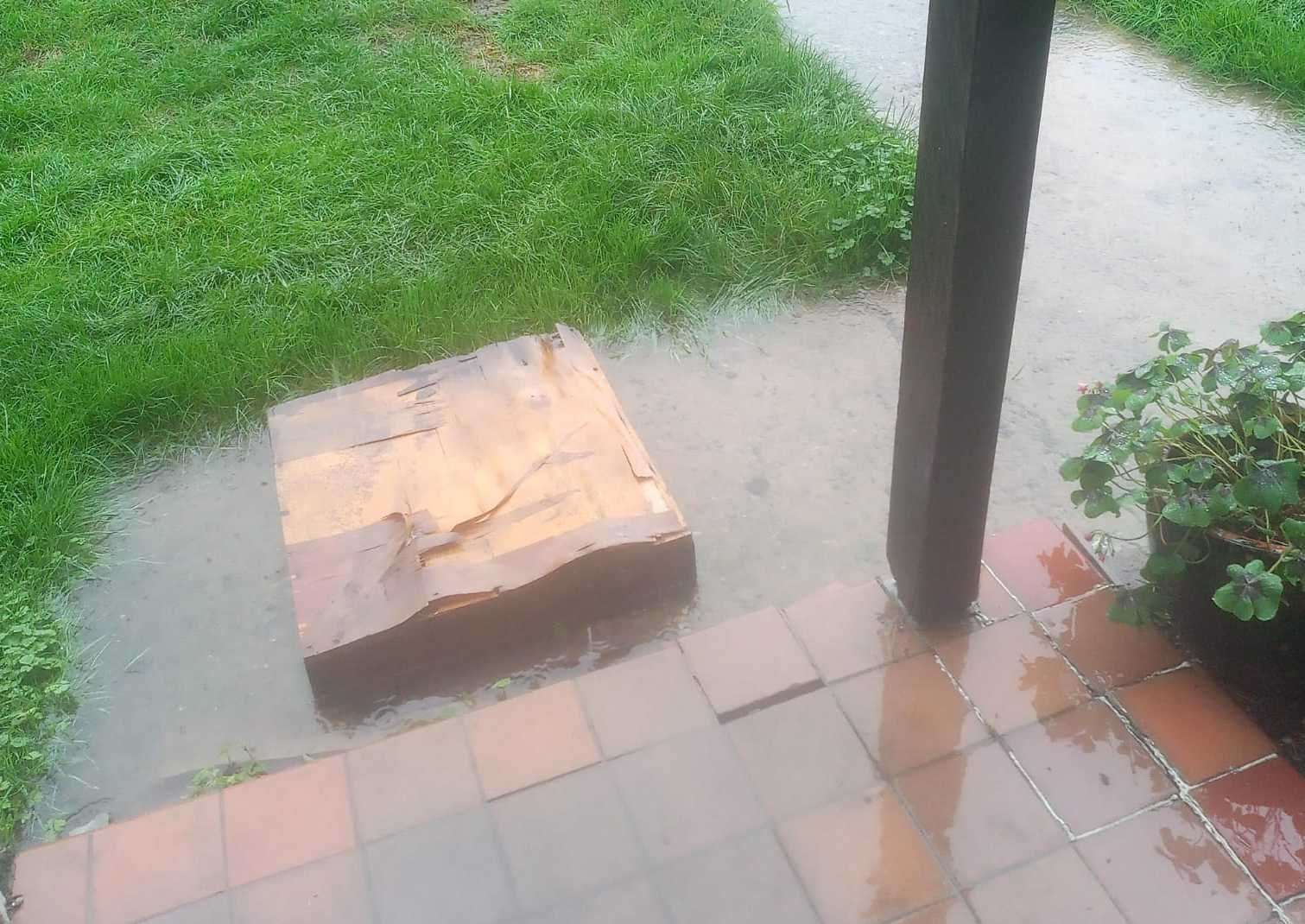 Water stagnating at the entranceway to the block of flats. Picture: Richard Glass