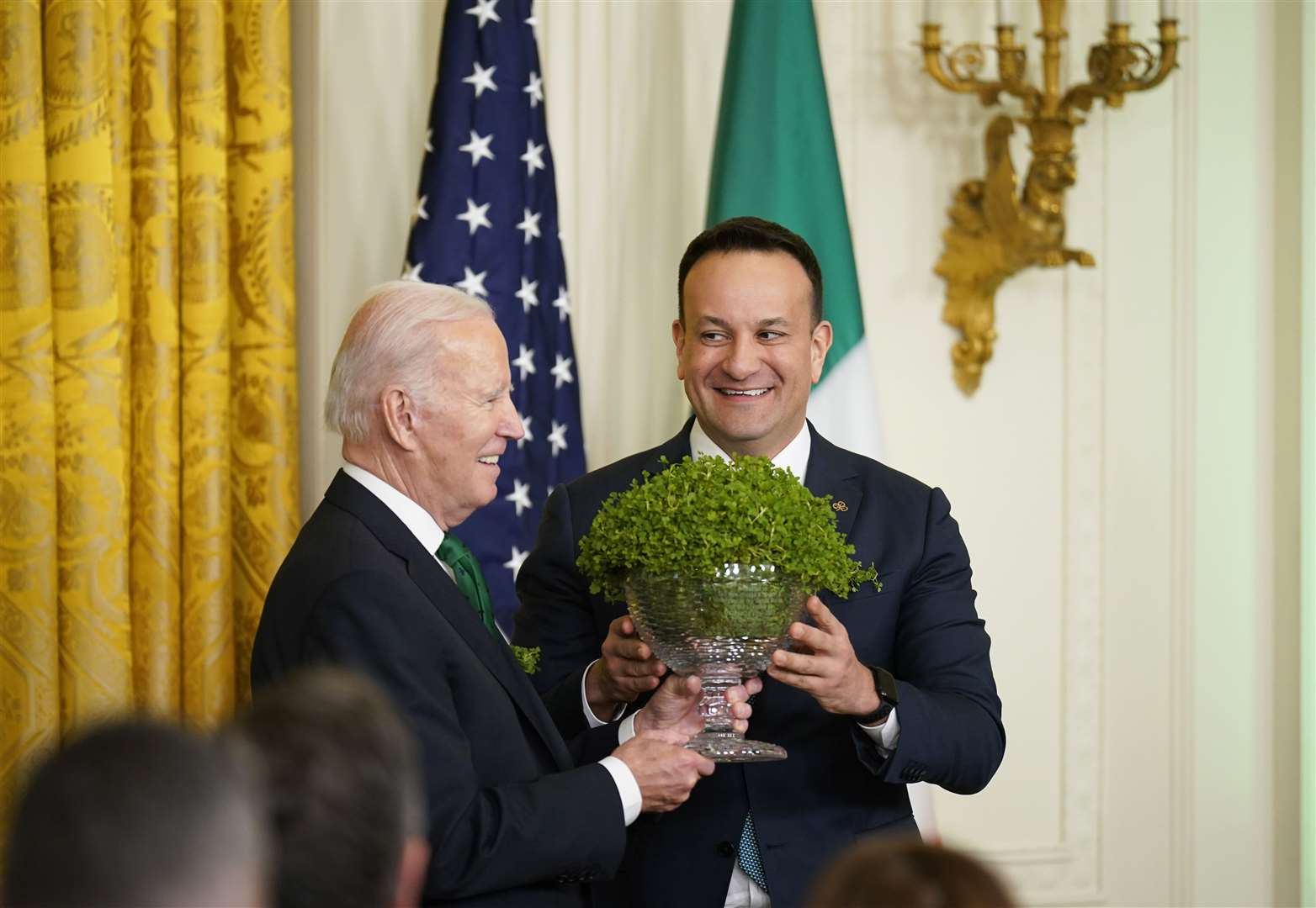 Then-taoiseach Leo Varadkar (right) presents US President Joe Biden with a bowl of shamrock during a St Patrick’s Day celebration reception at the White House in 2023 (PA)