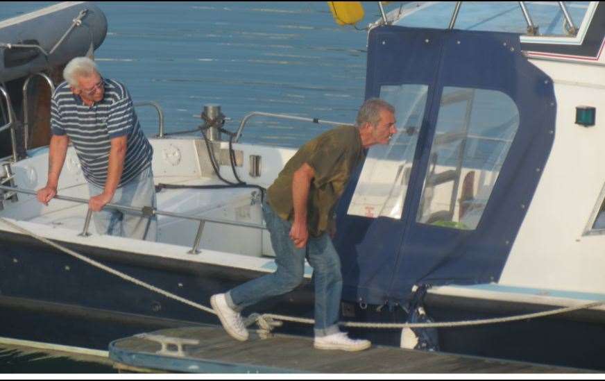 Ronald Scott and Paul Giglia untying Sorel Light at Dover Marina. Picture: NCA