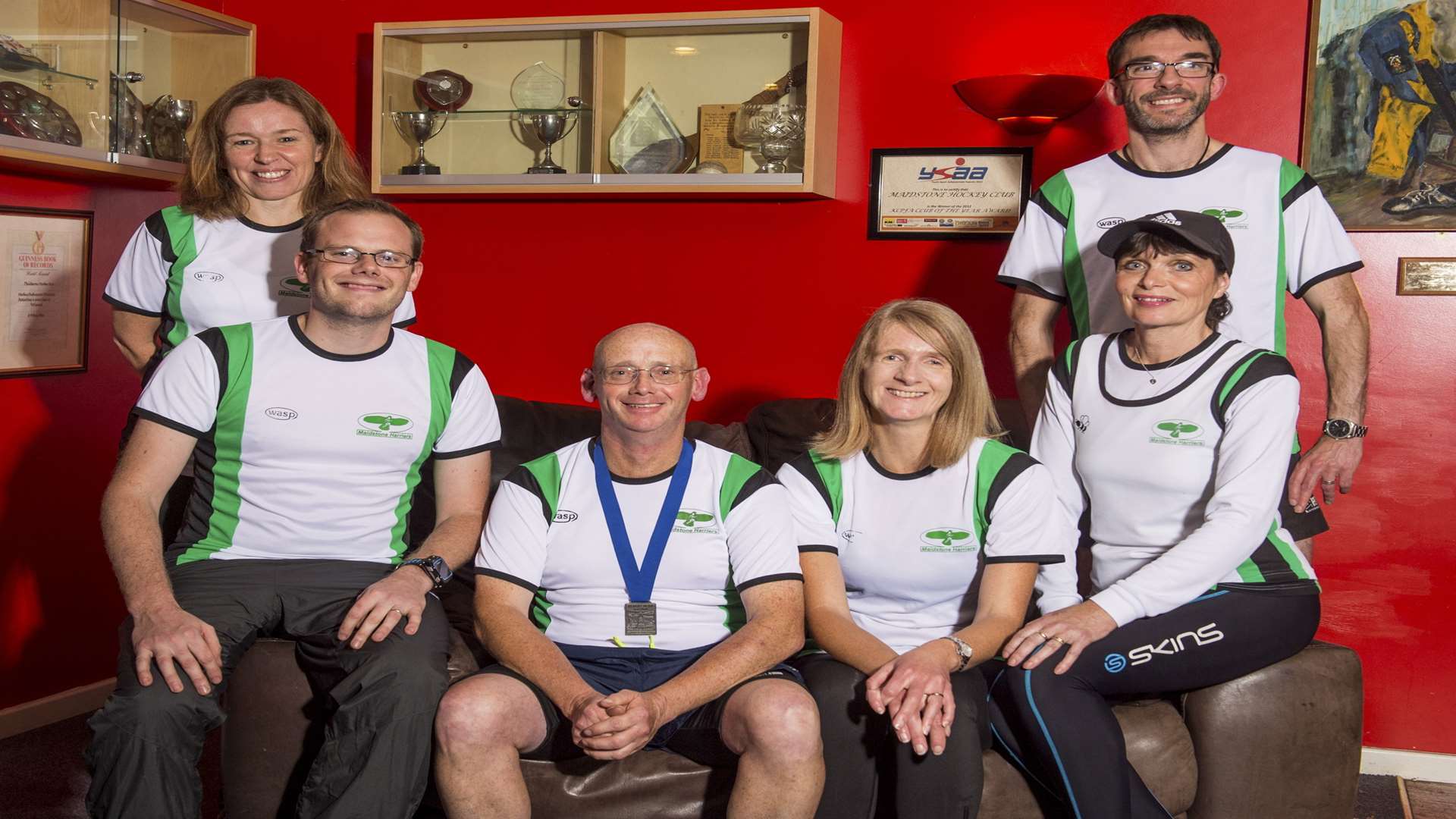 Dave Brooker with his running peers at the Maidstone Harriers clubhouse. Credit: David Pearce