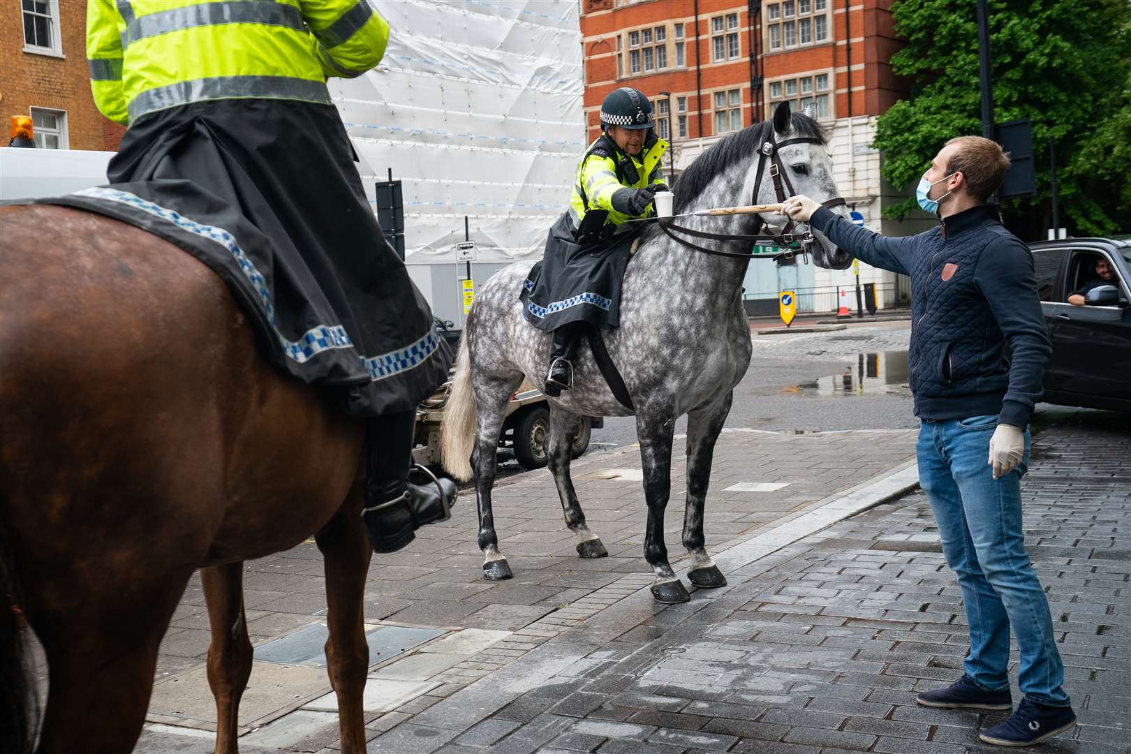 Police horses arrive at a free drive-through for the emergency services at The Berkeley Hotel in Knightsbridge, London (Aaron Chown/PA Wire)