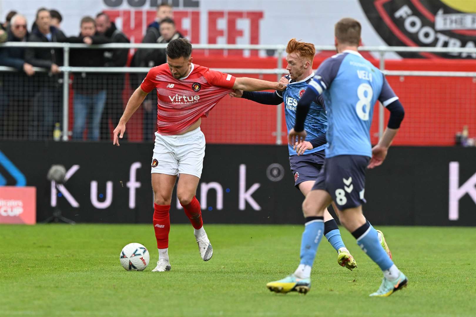 Luke O'Neill holds off his marker against Fleetwood. Picture: Keith Gillard