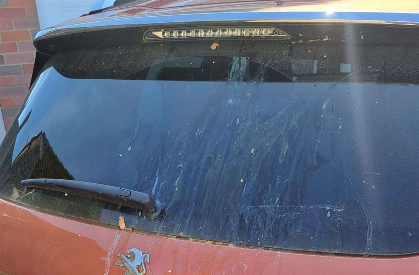 The mess left on the Peugeot 2008 after it was egged in Sainsbury's car park in Sittingbourne