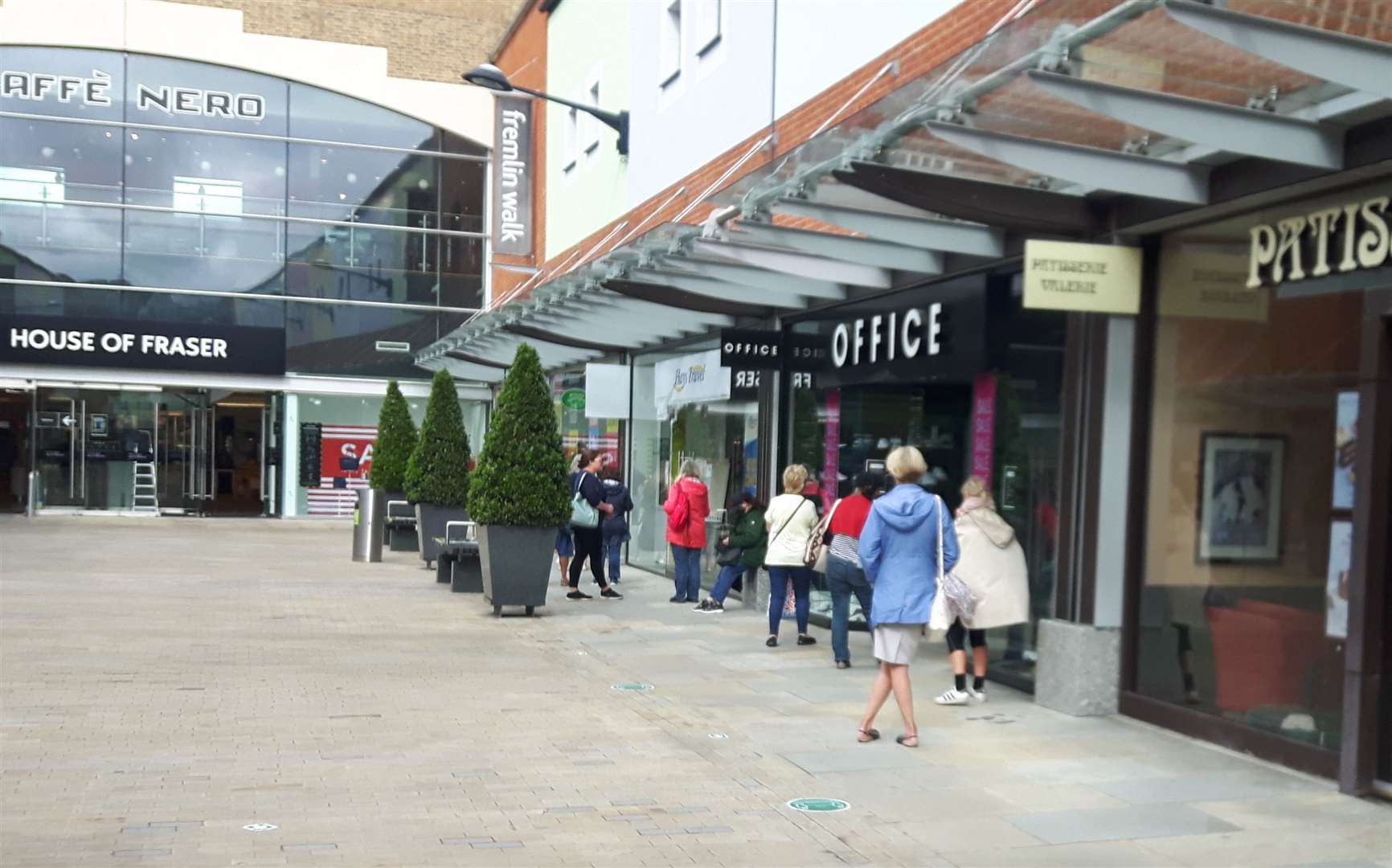 Shoppers queue outside Laura Ashley in Maidstone as it reopens for a closing down sale