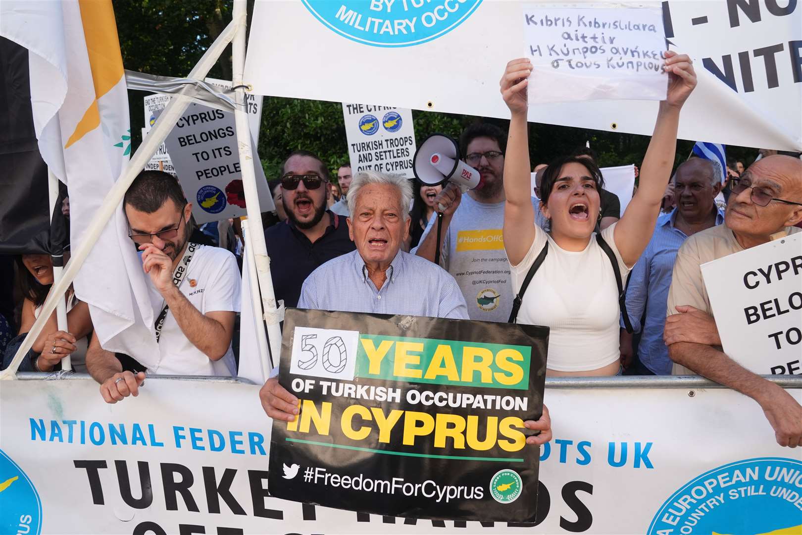 The protesters gathered outside the Turkish embassy in central London (Lucy North/PA)