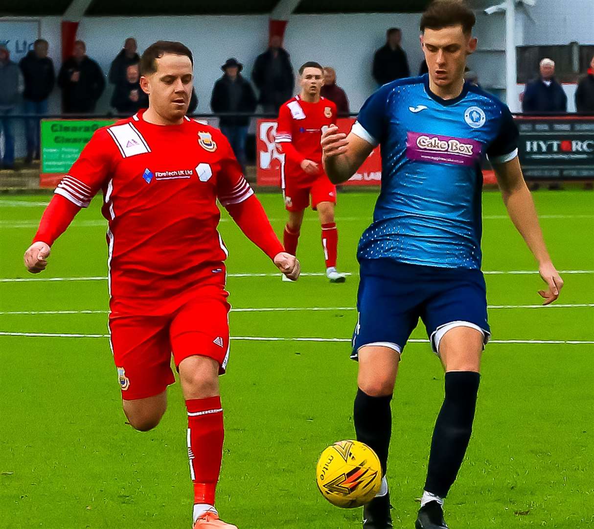 Whitstable midfielder Joe Nelder, left, closes in on a Punjab player. Picture: Les Biggs