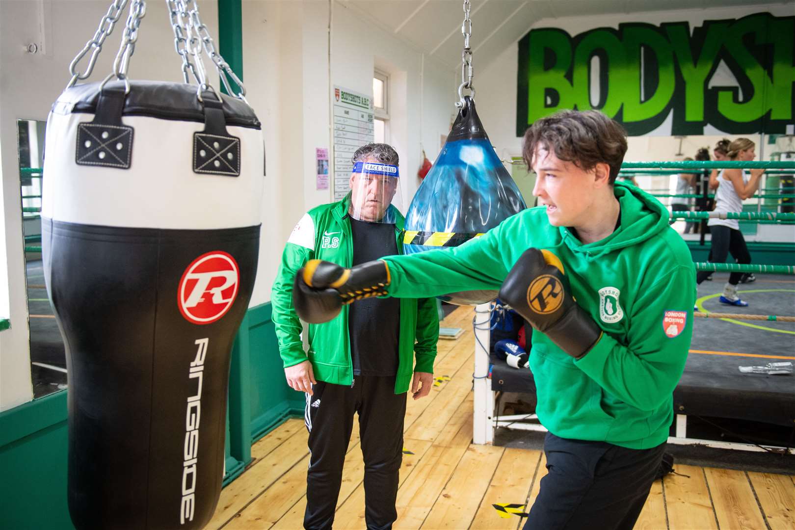 Pete Stanhope coaches Harry Fullagar at Bodyshots boxing gym (Dominic Lipinski/PA)