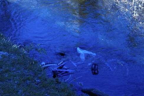 A dumped bike in the River Dour