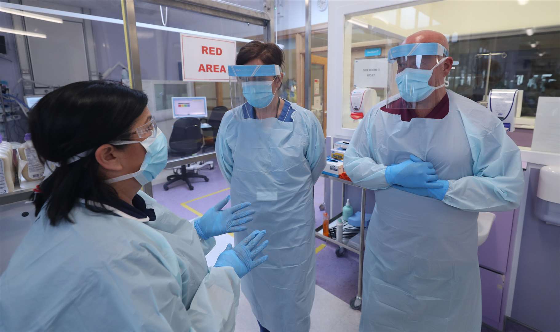 From left, infection control nurse Annette O’Hara, clinical sister Siobhan Donnelly, and infection control nurse Colin Clarke in the intensive care ward at Craigavon Area Hospital in Co Armagh, Northern Ireland (Niall Carson/PA)