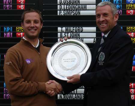 Walmer and Kingsdown professional Richard Wallis left receives the Order of Merit salver from Southern regional captain Rob Edwards