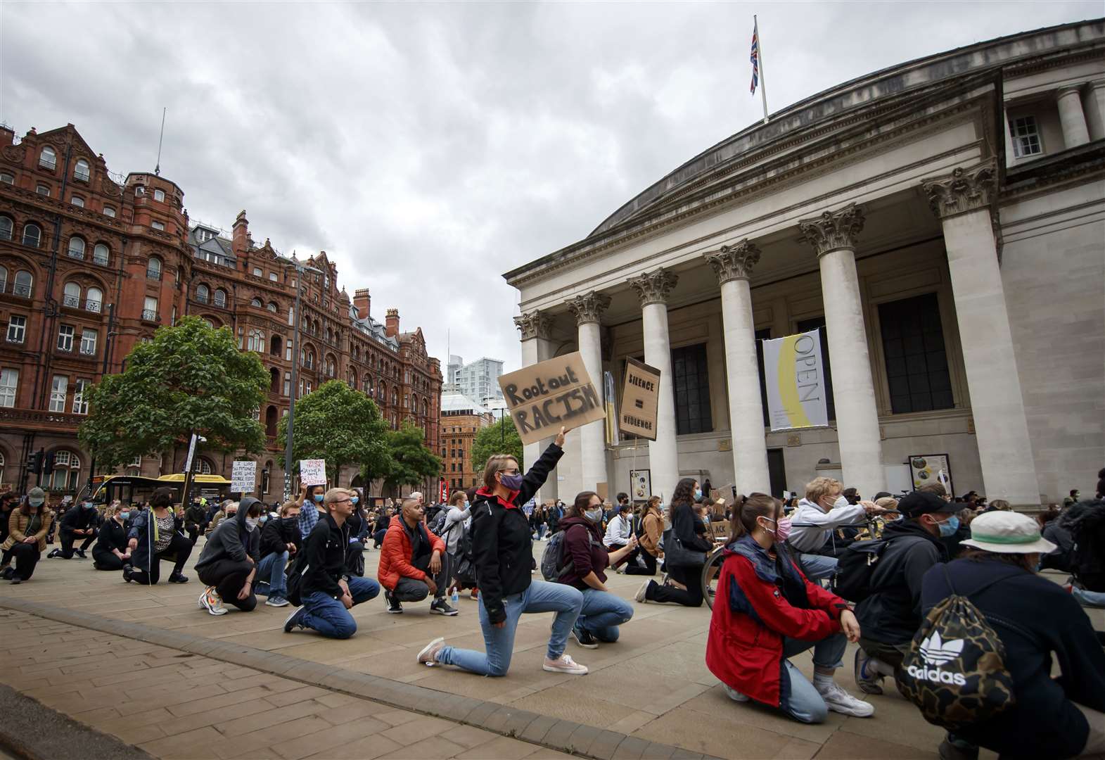 Protesters go down on one knee in Manchester (Danny Lawson/PA)