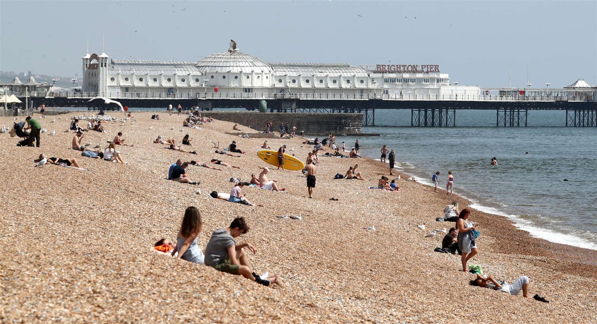 People on the beach during the warm weather in Brighton (Gareth Fuller/PA)