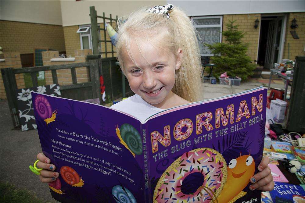 Blossom Catt, aged six, takes part in Kemsley's household sale.