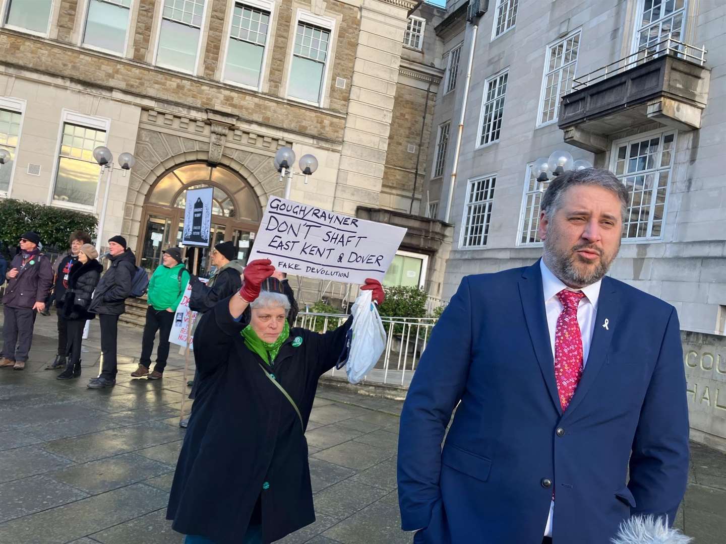 Green Party group leader Rich Lehmann gives a TV interview outside County Hall this morning during a demo