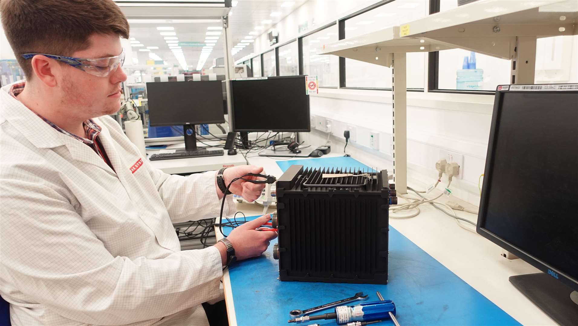 James Wentworth carrying out initial safety checks on a flight control system.