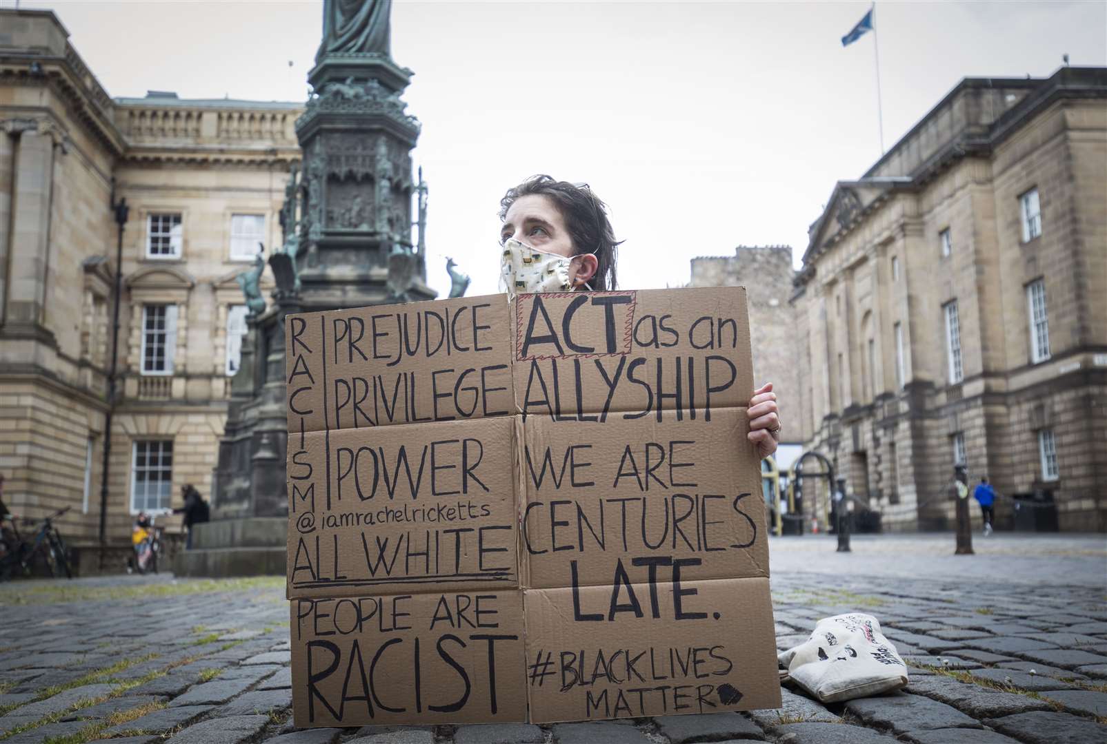 A protestor in Edinburgh’s Parliament square on Wednesday (Jane Barlow/PA)