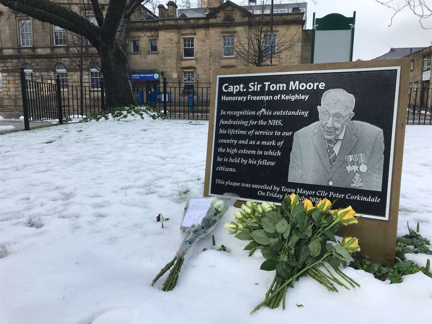 Tributes at the plaque in Town Hall Square, Keighley, the West Yorkshire town where the veteran was born (Richard McCarthy/PA)