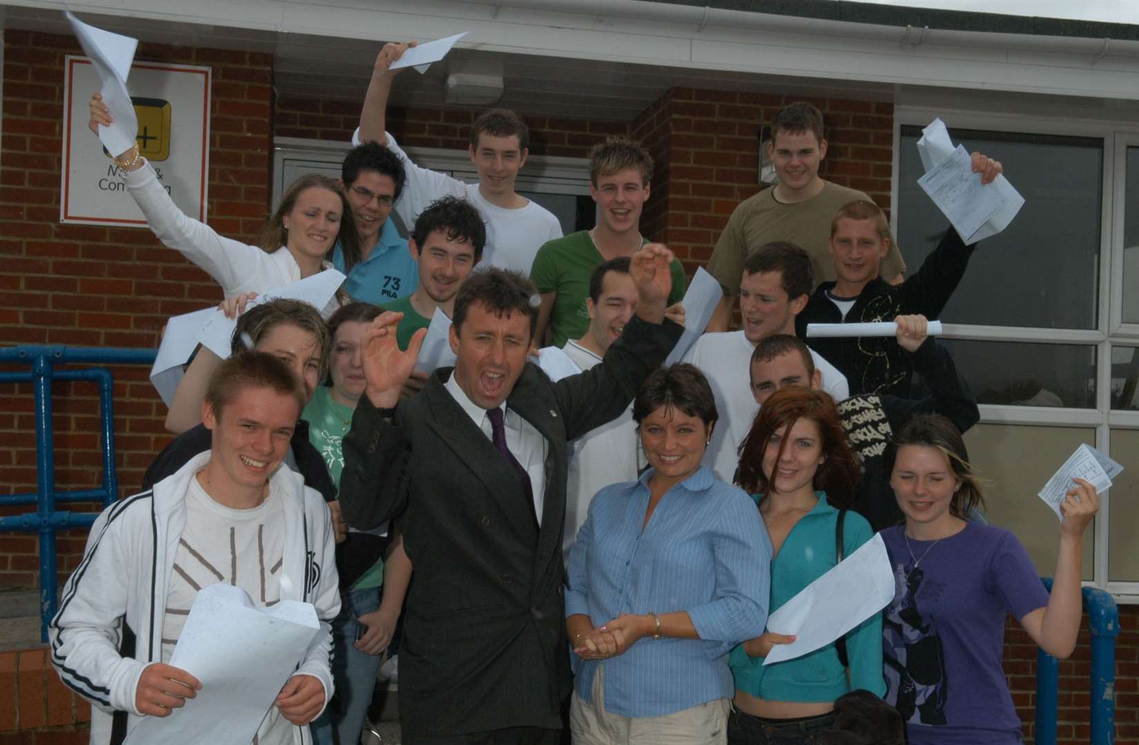 The class of 2004 at Westlands School in Sittingbourne celebrate with the new headteacher at the time, Jon Whitcombe, and the director of sixth form Mrs McGowan. Picture: Mike Smith