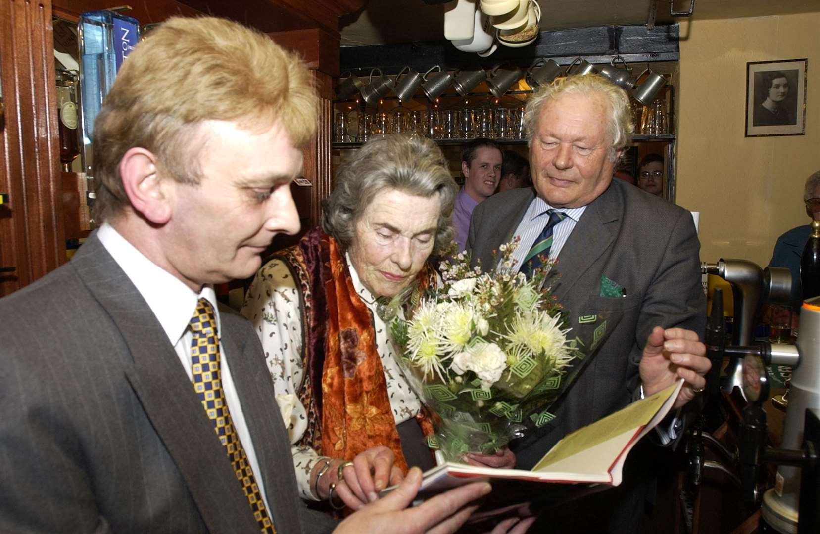 Countess Mountbatten presented with a gift from Robert Neame after she reopened the Royal Oak, pictured with landlord Ian Cook
