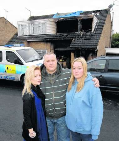 The family who helped save the occupants from the fire. Laura Dee Jefferson in the dark blue jumper with husband and wife Sarah-Jo Vane and Anthony Vane.