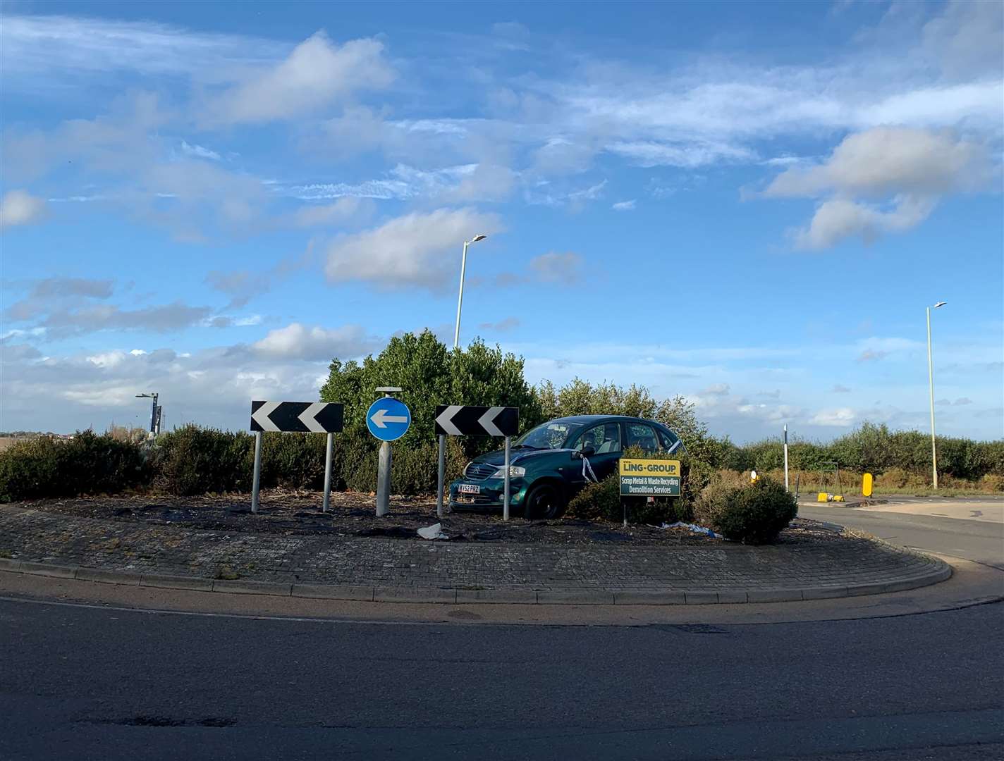 A car has been left on a roundabout in Canterbury for more than two weeks
