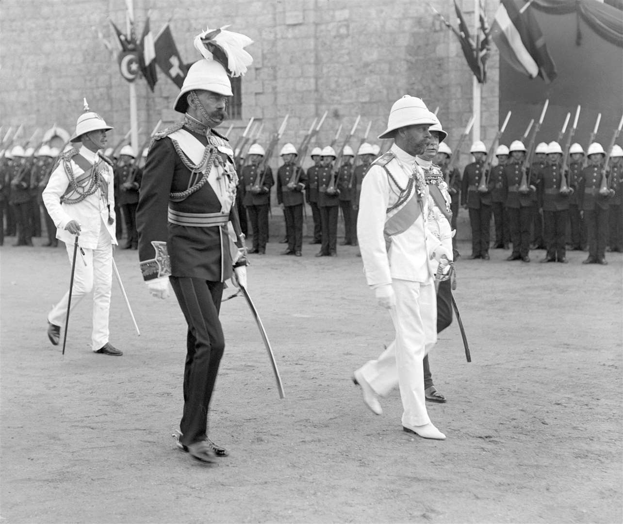 King George V, accompanied by Lord Kitchener, during an official royal visit to Sudan (PA)