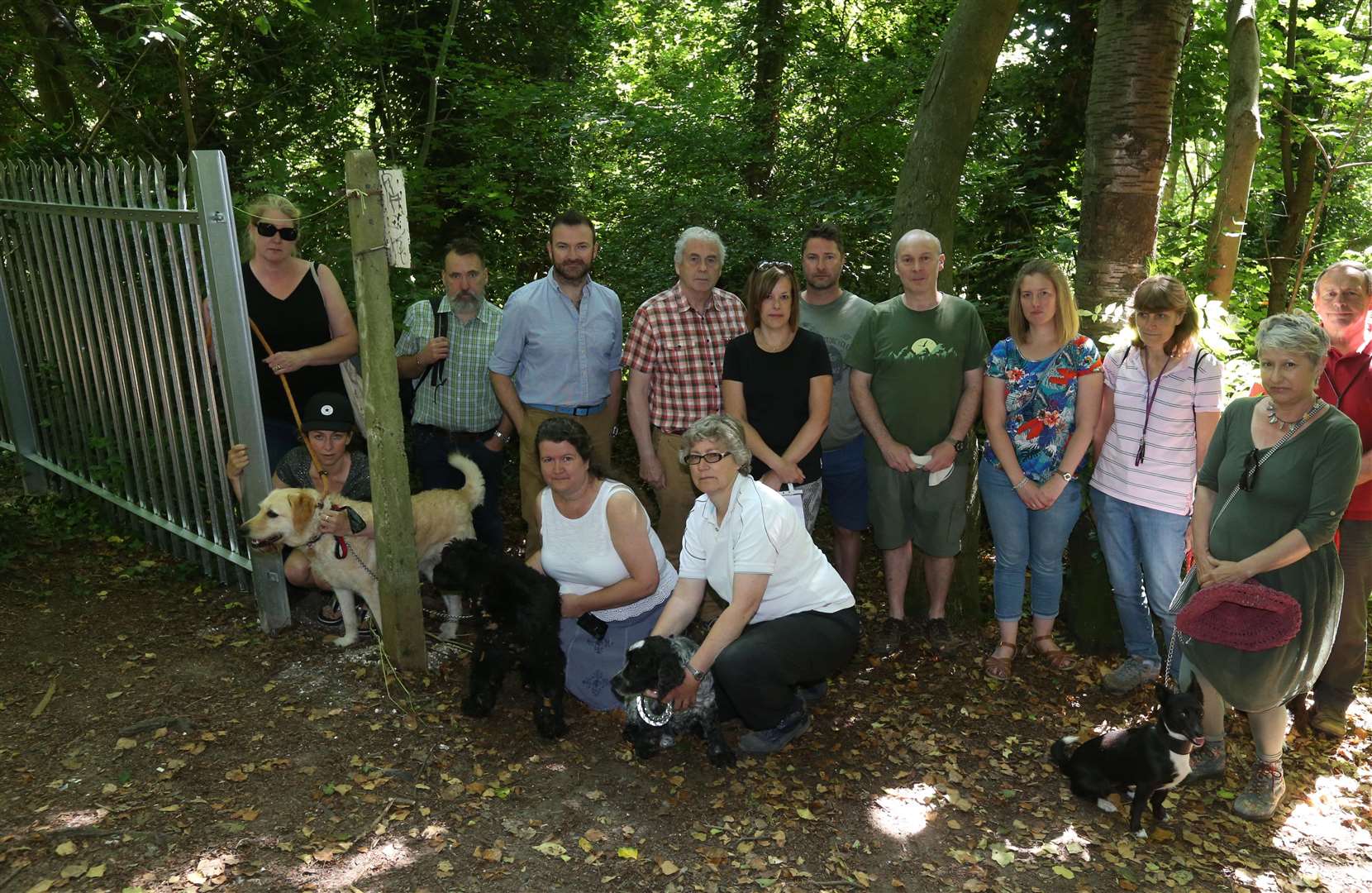 Concerned residents at the spiked fence which has been installed