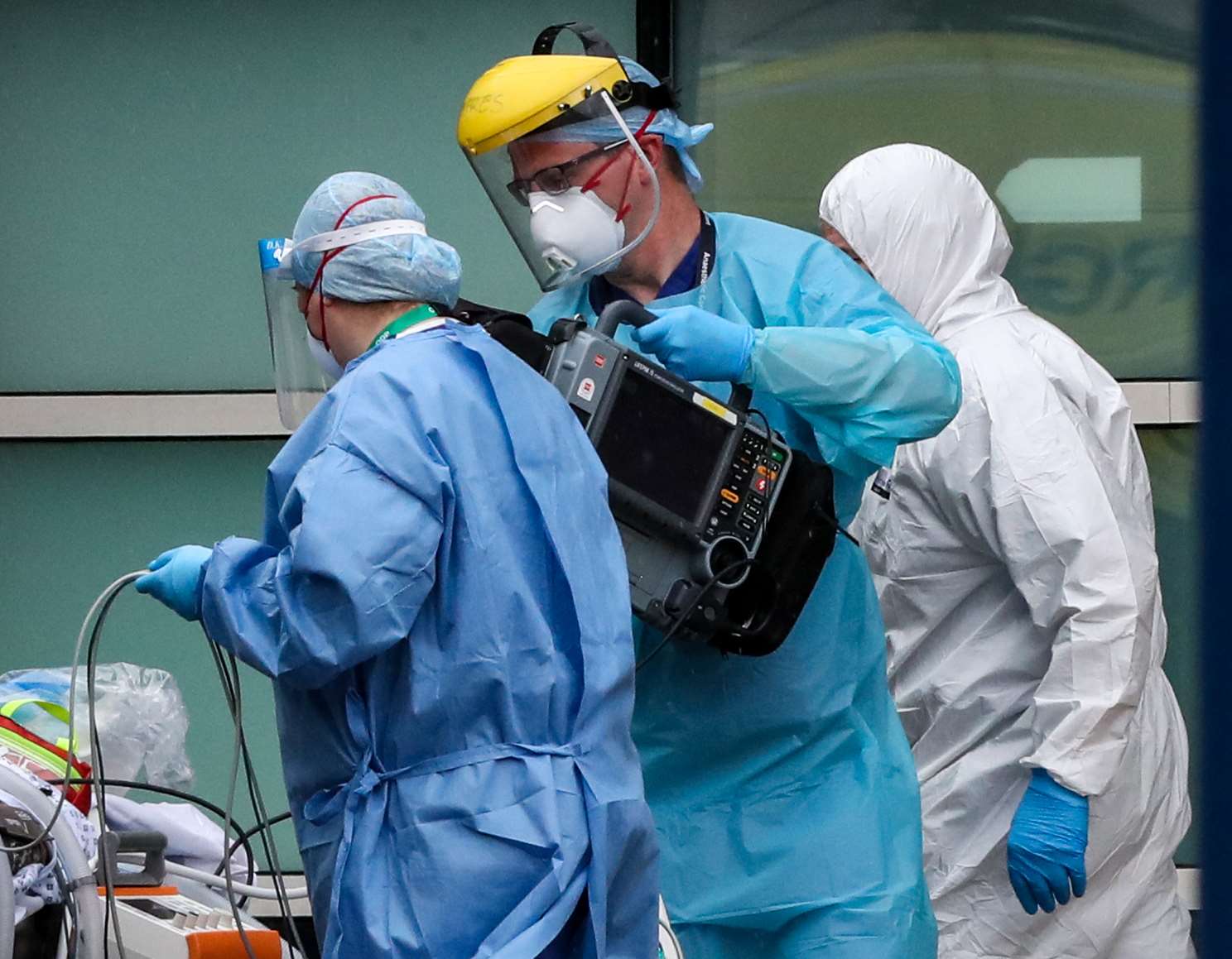 Paramedics and staff at the Royal Liverpool University Hospital wearing various items of PPE (Peter Byrne/PA)