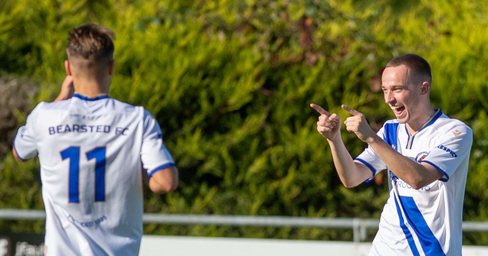 Bearsted's hat-trick hero Michael Hagan celebrates with team-mate Robbie Roberts during their 5-2 home win against Hollands & Blair. Picture: Ian Scammell