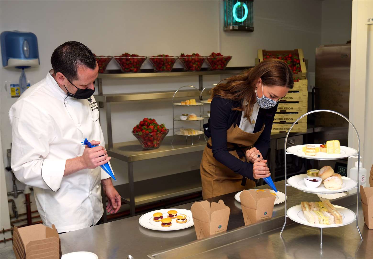 The Duchess of Cambridge helped prepare strawberry desserts in the kitchens at Wimbledon during her visit (John Walton/PA)