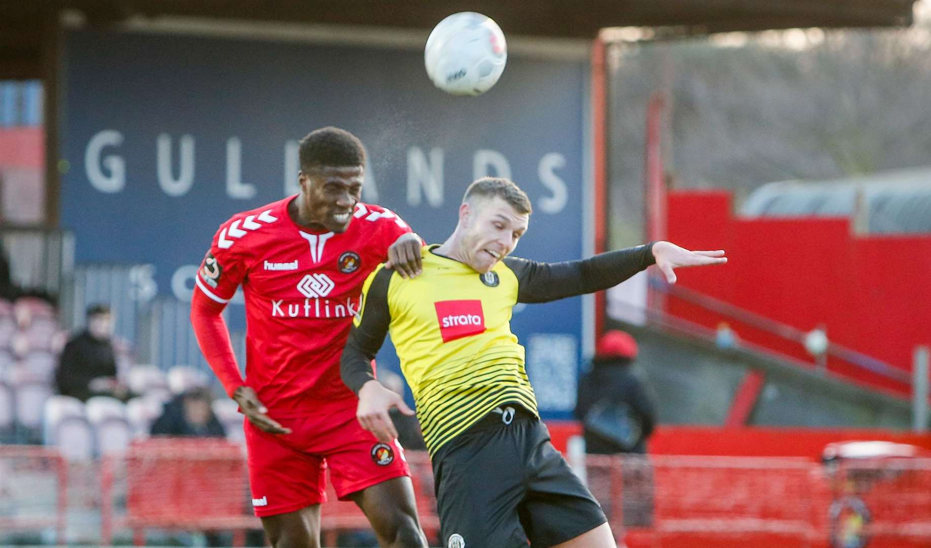 Fleet's Marvel Ekpiteta wins the ball in the air against Harrogate. Picture: Matthew Walker FM27043606