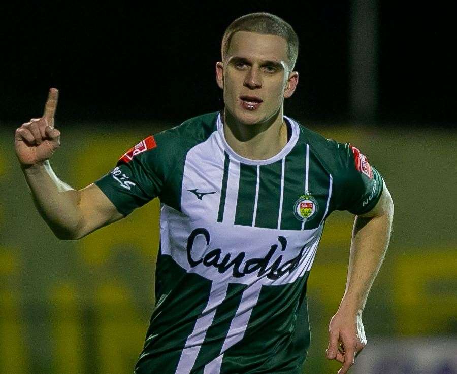 Noah Carney celebrates after adding a third for Ashford to seal their home win against Herne Bay. Picture: Ian Scammell