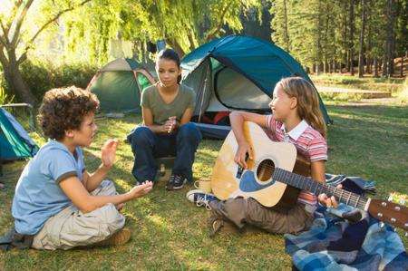 Campers pitch a tent