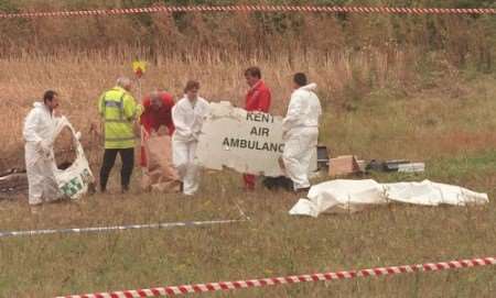 Investigators scour scene of the crash