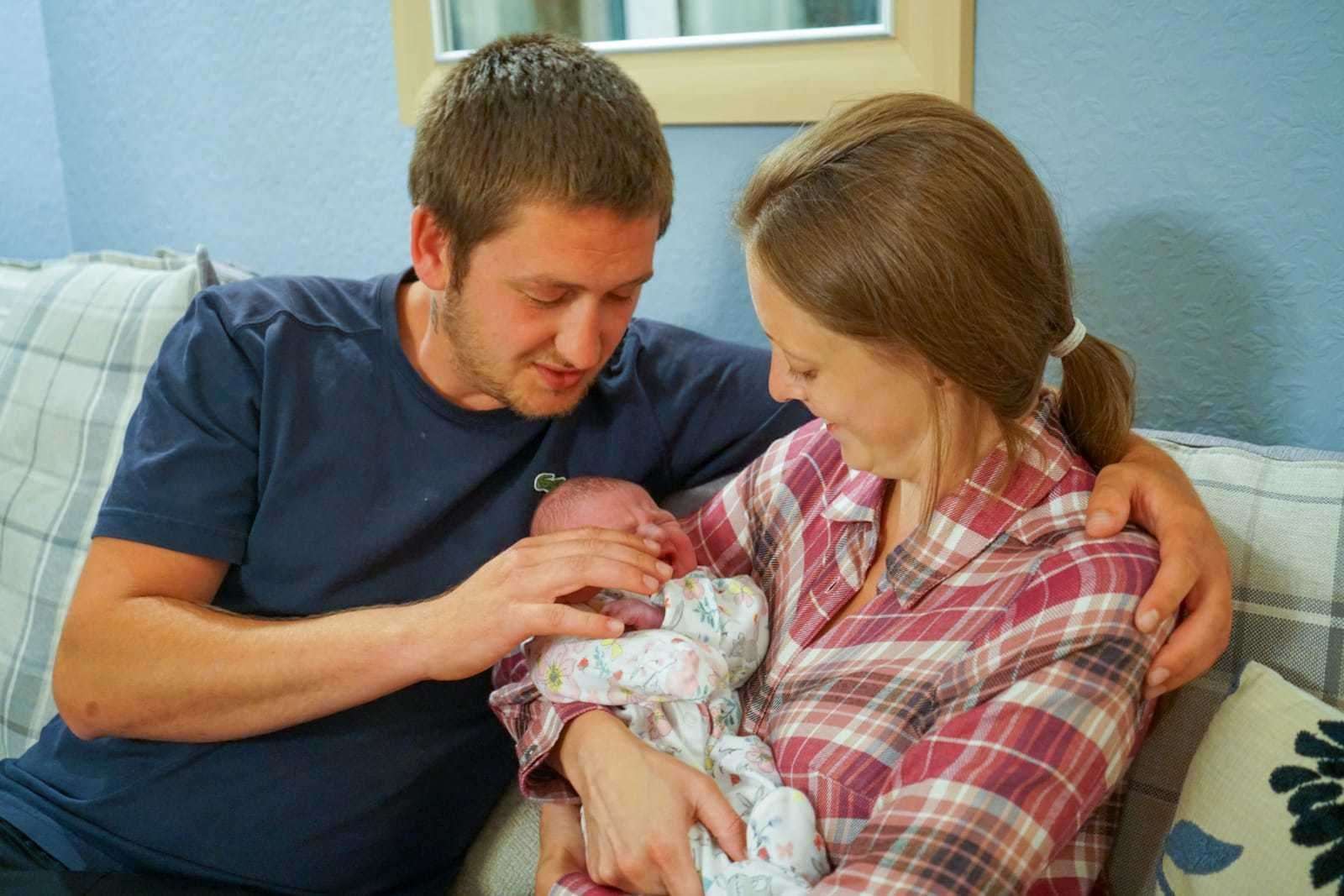 Mum and dad Scott Hall and Lara Ashton with baby Isabella