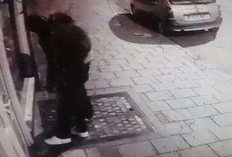 Two men in dark clothing were seen acting suspiciously outside