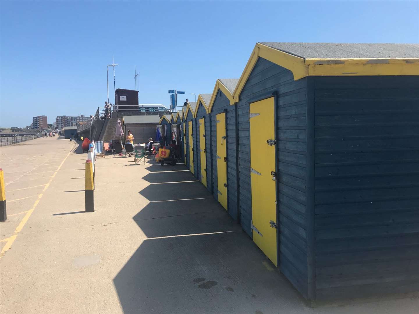 Beach huts line the sea wall