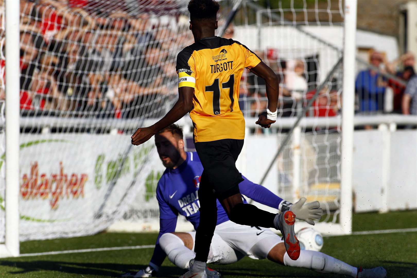 Blair Turgott beats Dean Brill for Maidstone's opener. Seconds earlier, he'd been on the edge of his own box Picture: Sean Aidan