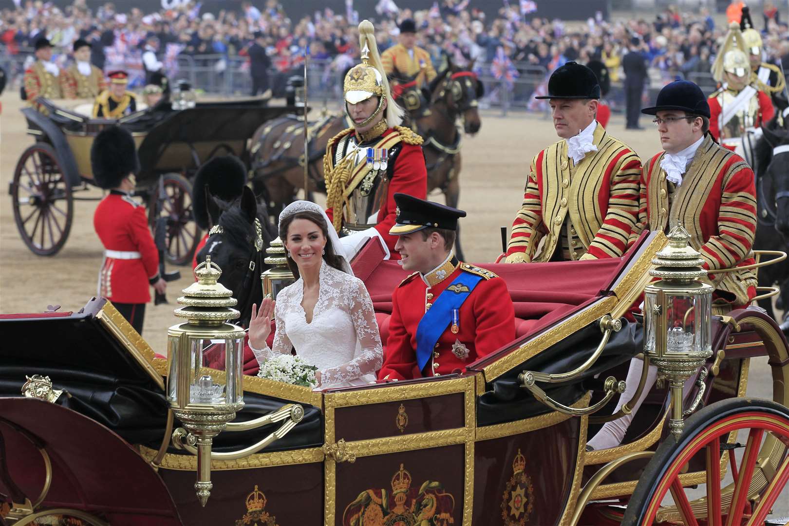 The newlyweds pass through Horse Guards Parade, enroute to Buckingham Palace (Sang Tan/PA)