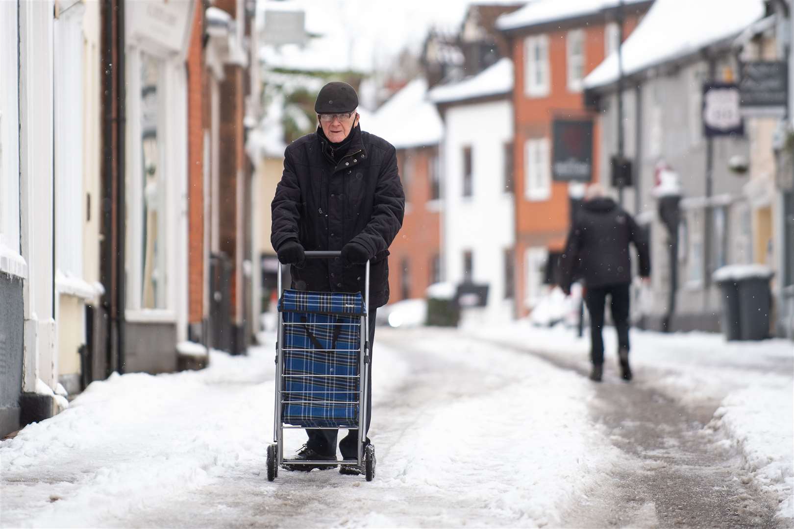 A man pushes his trolley through Woodbridge in Suffolk (Joe Giddens/PA)