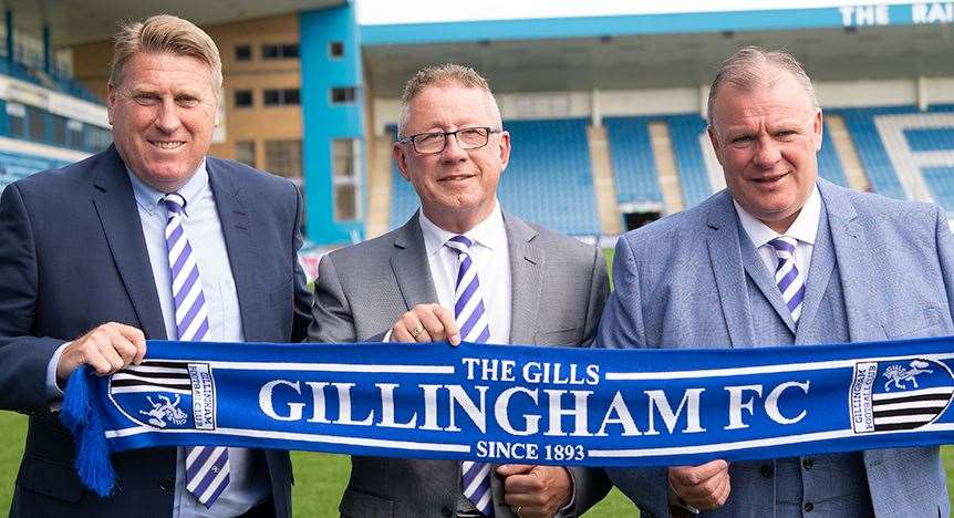 Gillingham assistant Paul Raynor, with chairman Paul Scally and new boss Steve Evans at Priestfield Picture: Ady Kerry